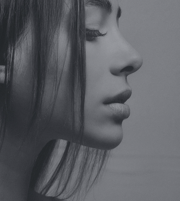 Black and white picture of young girl with beautiful nose silhouette after rhinoplasty